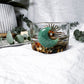 Wild Wealth Charging Bowl | Green Aventurine, Gold Sun Charm, and Earthy Herbal Blend