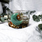 Wild Wealth Charging Bowl | Green Aventurine, Gold Sun Charm, and Earthy Herbal Blend