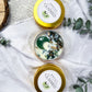 Claimed: Abundance Travel Candle with Green Aventurine, Moss Agate, and Eucalyptus Patchouli Scent for Prosperity and Grounding